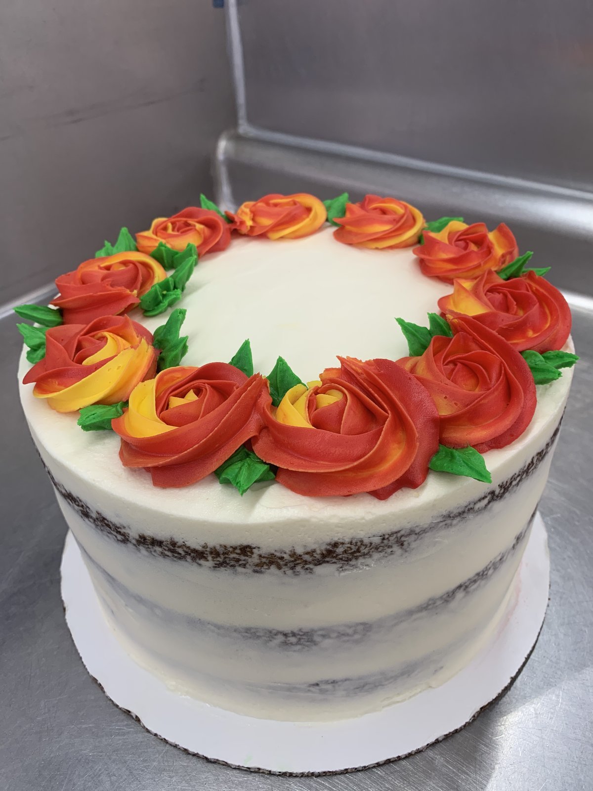 Tiered cake with peach roses